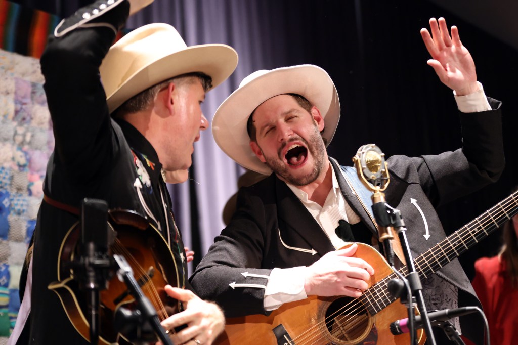 Andrew Heist and Josh Fortenberry of the Muskeg Collective sing perform during the Cowboy Ball in Juneau, Alaska.